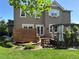 Charming backyard with wooden privacy fence, a pergola covered hot tub and lush lawn at 4765 Larksong Dr, Castle Rock, CO 80109