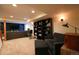 Spacious finished basement with a large TV, comfortable seating, and a storage unit at 4765 Larksong Dr, Castle Rock, CO 80109