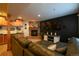 Finished basement offers a fireplace, TV, seating, and kitchenette at 4765 Larksong Dr, Castle Rock, CO 80109
