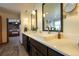 Bright bathroom features double vanity with vessel sinks and modern fixtures, with bedroom in background at 4765 Larksong Dr, Castle Rock, CO 80109