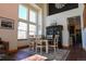 The dining area features high ceilings, great light, and adjoins the kitchen at 4765 Larksong Dr, Castle Rock, CO 80109