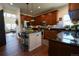 Charming kitchen featuring rich wood cabinetry, stainless appliances, and a center island at 4765 Larksong Dr, Castle Rock, CO 80109