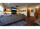 Comfortable living room with a fireplace, built-ins, and a staircase at 4765 Larksong Dr, Castle Rock, CO 80109