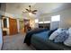 Inviting main bedroom featuring a barn door to ensuite, fireplace, and soothing decor for relaxation at 4765 Larksong Dr, Castle Rock, CO 80109