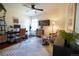 Cozy office with hardwood floors, ceiling fan, and a sitting area at 4765 Larksong Dr, Castle Rock, CO 80109
