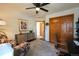 Bright office features hardwood floors, ceiling fan, closet, and large cabinet at 4765 Larksong Dr, Castle Rock, CO 80109