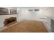 Finished basement space featuring a decorative fireplace and plush carpet at 5800 E 6Th Avenue Pkwy, Denver, CO 80220