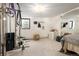 Finished basement area with workout equipment and space for activities at 5800 E 6Th Avenue Pkwy, Denver, CO 80220