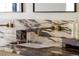 Close-up of bathroom with marble countertop and stylish gold faucet fixture at 5800 E 6Th Avenue Pkwy, Denver, CO 80220
