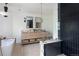 Bright bathroom with soaking tub, double sink vanity and a glass enclosed shower at 5800 E 6Th Avenue Pkwy, Denver, CO 80220