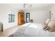 Bright bedroom with a white vaulted ceiling, ample natural light, and minimal decor for a peaceful atmosphere at 5800 E 6Th Avenue Pkwy, Denver, CO 80220