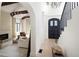Foyer featuring front door, staircase, and living room at 5800 E 6Th Avenue Pkwy, Denver, CO 80220