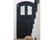 Elegant front door with stained glass panel adjacent to staircase at 5800 E 6Th Avenue Pkwy, Denver, CO 80220