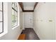 Bright hallway with built-in storage, arched windows, and patterned flooring, offering a welcoming entrance at 5800 E 6Th Avenue Pkwy, Denver, CO 80220