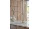 Modern kitchen sink and white countertop with a modern gold faucet fixture at 5800 E 6Th Avenue Pkwy, Denver, CO 80220