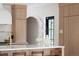 Bright kitchen with wood cabinets, white countertops, and modern fixtures at 5800 E 6Th Avenue Pkwy, Denver, CO 80220