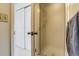 Bathroom showing tiled shower with frosted glass door and closet beyond doorway at 60 S Boulder # 6031, Boulder, CO 80303