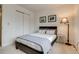 Bedroom featuring a black headboard, neutral decor, and sliding closet doors at 60 S Boulder # 6031, Boulder, CO 80303