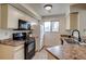 Clean kitchen featuring black appliances and ample counter space at 60 S Boulder # 6031, Boulder, CO 80303