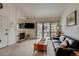 Open-concept living room with fireplace and balcony access, providing bright and airy space at 60 S Boulder # 6031, Boulder, CO 80303