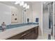 Bathroom featuring a modern vanity, blue tile backsplash, and a shower-tub combination at 481 Meadowleaf Ln, Highlands Ranch, CO 80126