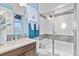 Bright bathroom with modern finishes, including a glass-enclosed shower and sleek vanity at 481 Meadowleaf Ln, Highlands Ranch, CO 80126
