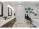 Bathroom with a dual sink vanity, decor, and a soaking tub at 481 Meadowleaf Ln, Highlands Ranch, CO 80126