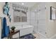 Well-lit bathroom featuring a soaking tub, glass shower, and modern finishes at 481 Meadowleaf Ln, Highlands Ranch, CO 80126