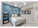 bedroom featuring airplane decor, a comfortable bed, and ladder shelving with decor accents at 481 Meadowleaf Ln, Highlands Ranch, CO 80126