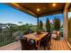 Outdoor dining area on a covered deck, featuring stylish furniture and scenic views at 481 Meadowleaf Ln, Highlands Ranch, CO 80126