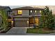 Charming two-story home featuring a stone-accented facade, well-maintained landscaping, and a convenient two-car garage at 481 Meadowleaf Ln, Highlands Ranch, CO 80126