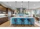 Stylish kitchen featuring an island with seating and stainless steel appliances at 481 Meadowleaf Ln, Highlands Ranch, CO 80126