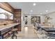 Cozy living room showcasing wood accent wall, modern furnishings, and bright natural light at 481 Meadowleaf Ln, Highlands Ranch, CO 80126