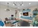 Stylish living area featuring modern lighting, sleek furniture, and vibrant decor on a colorful striped rug at 481 Meadowleaf Ln, Highlands Ranch, CO 80126