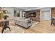 Modern living room featuring stylish wood accent wall, comfortable seating, and contemporary decor at 481 Meadowleaf Ln, Highlands Ranch, CO 80126