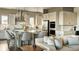 Cozy living room open to the kitchen, perfect for entertaining guests at 16500 Black Rose Cir, Parker, CO 80134