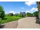 Large backyard with a patio, green grass and landscaping at 35 N Newcastle Ct, Aurora, CO 80018