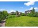 A well manicured backyard with healthy green grass and full landscaping at 35 N Newcastle Ct, Aurora, CO 80018