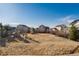 Spacious backyard featuring a playset and a volleyball net, perfect for outdoor activities at 35 N Newcastle Ct, Aurora, CO 80018