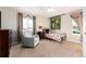 A bedroom featuring a chair and colorful accents at 35 N Newcastle Ct, Aurora, CO 80018