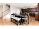 Spacious dining area with seating and stairs leading to the second floor at 35 N Newcastle Ct, Aurora, CO 80018