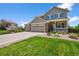 Charming two-story home featuring a three-car garage, well-maintained landscaping, and inviting front porch at 35 N Newcastle Ct, Aurora, CO 80018