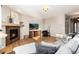 Comfortable living room with a fireplace, hardwood floors, and a cozy seating area at 35 N Newcastle Ct, Aurora, CO 80018