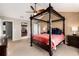 A lovely main bedroom featuring a four-poster bed and a ceiling fan at 35 N Newcastle Ct, Aurora, CO 80018