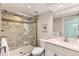 Modern bathroom with glass shower and a marble vanity at 1012 Fillmore St, Denver, CO 80206