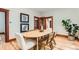 Well-lit dining room featuring wooden furniture, hardwood floors, and decorative wall art at 1012 Fillmore St, Denver, CO 80206