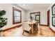 Bright dining room with hardwood floors and large windows, perfect for Gathering gatherings at 1012 Fillmore St, Denver, CO 80206