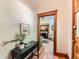Welcoming entryway leading to the living room with a wooden fireplace and hardwood floors at 1012 Fillmore St, Denver, CO 80206