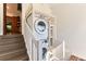 Conveniently stacked washer and dryer unit next to a staircase at 1012 Fillmore St, Denver, CO 80206