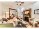 Comfortable living room with a decorative fireplace, wood floors, and seamless flow to the dining area at 1012 Fillmore St, Denver, CO 80206